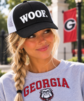 Model wearing the University of Georgia Honey Lid with white WOOF. puff embroidery
