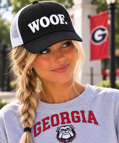 Model wearing the University of Georgia Honey Lid with white WOOF. puff embroidery
