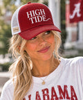 Honey Lid: University of Alabama — crimson and white Richardson 115 trucker with raised white High Tide embroidery, worn on model