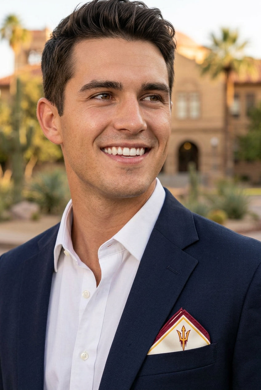 Young man in a navy blazer and white open-collar shirt wearing the Arizona State University Honey Pocket folded in his breast pocket