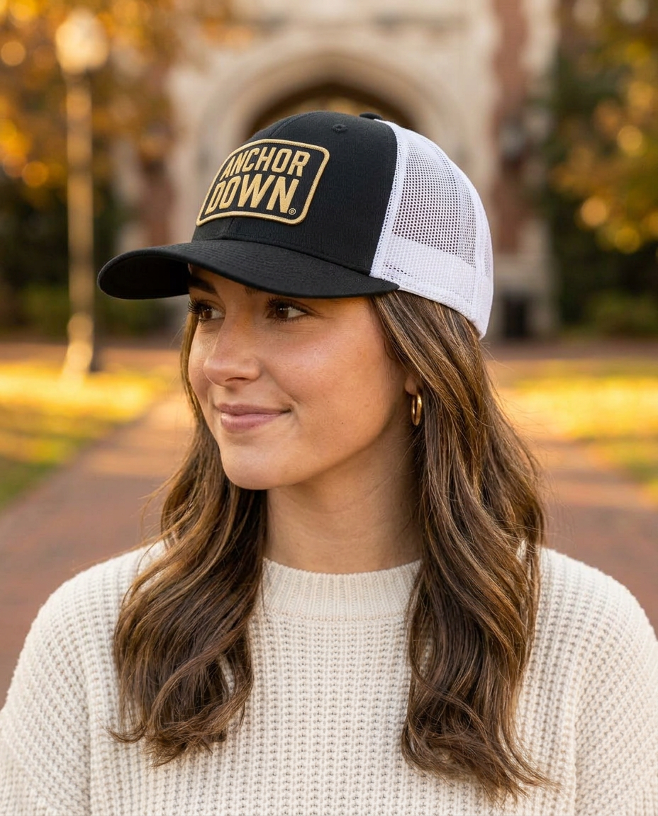 Woman wearing the b.Honey Lid: Vanderbilt University in Black / White Mesh, turned to the side