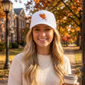 Blonde woman wearing the all-white b.Honey Lid: Auburn University with orange eagle embroidery