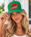 Model wearing the b.Honey Naturally Lucky green trucker hat