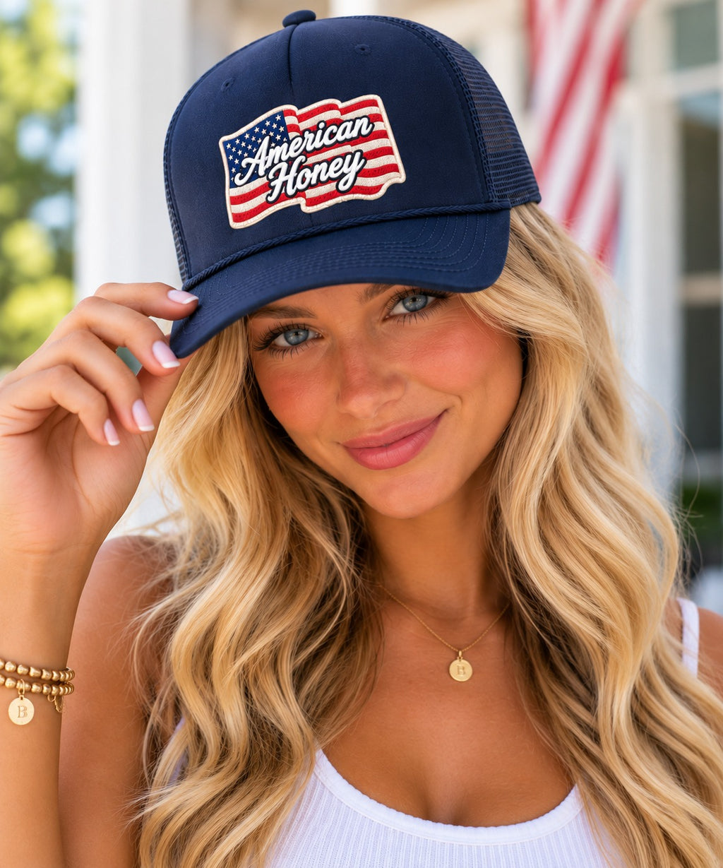 Model wearing the navy b.Honey American Honey low-profile trucker hat