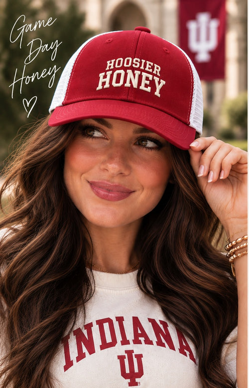 Woman wearing the Honey Lid: Indiana University crimson Hoosier Honey trucker hat