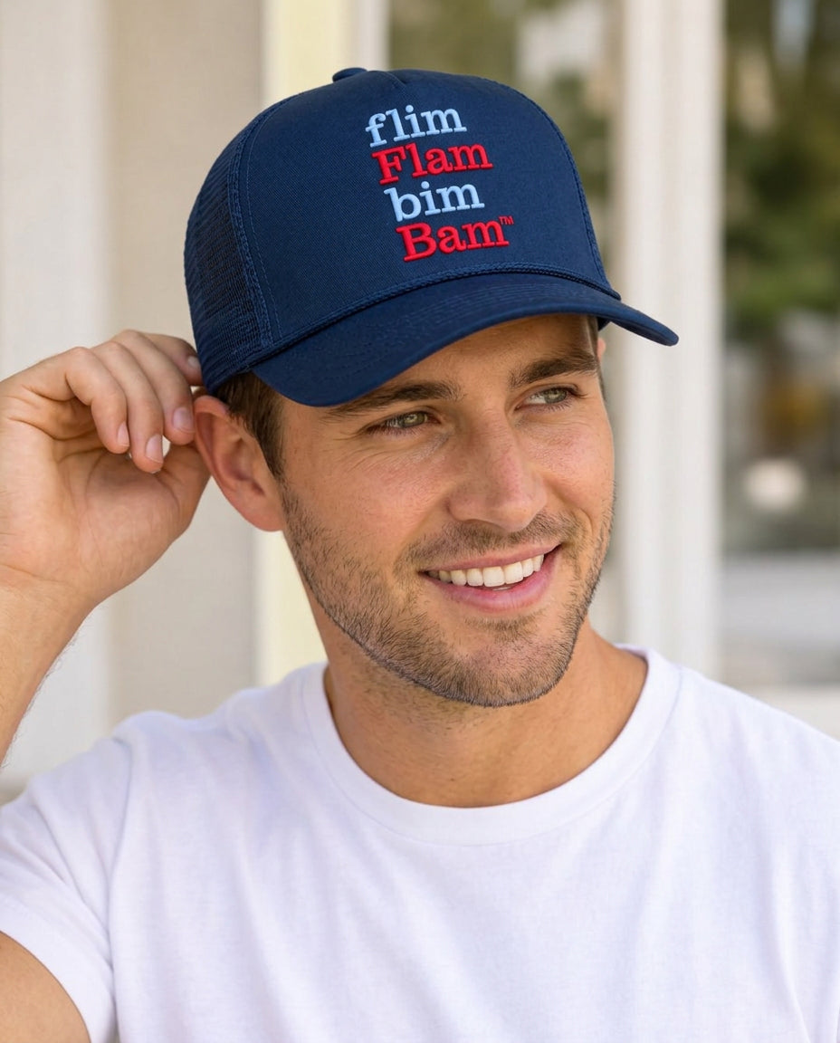 Man wearing the navy b.Honey Lid University of Mississippi trucker with light blue and red flim Flam bim Bam embroidery