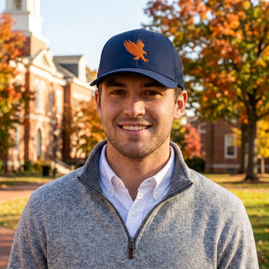 Man wearing the Auburn Blue b.Honey Lid: Auburn University with orange eagle embroidery