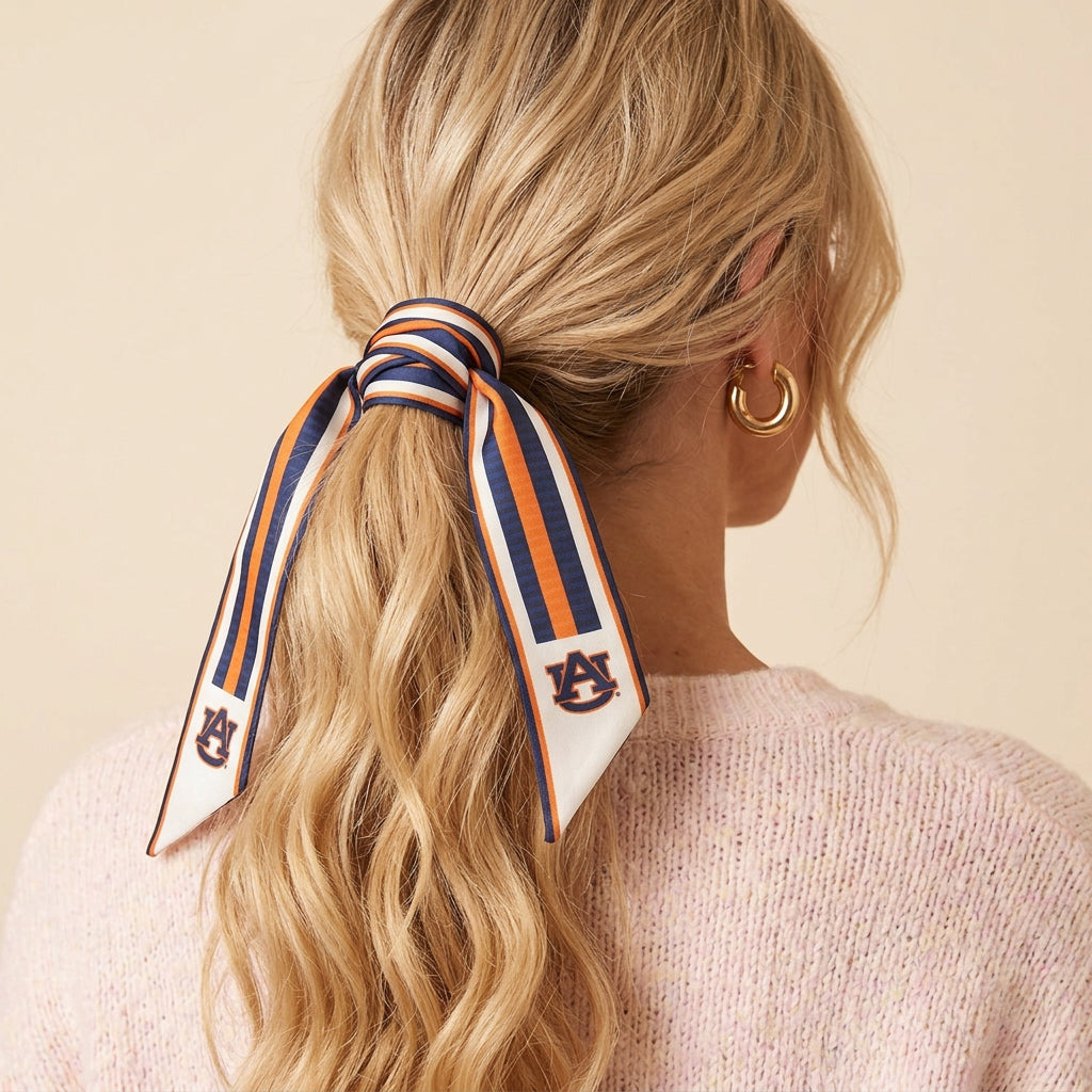 Auburn Ribbon tied around a blonde ponytail