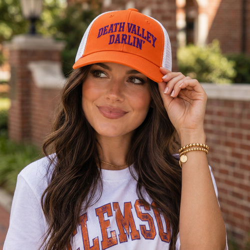 Woman wearing the orange b.Honey Lid: Clemson University with Death Valley Darlin' embroidery
